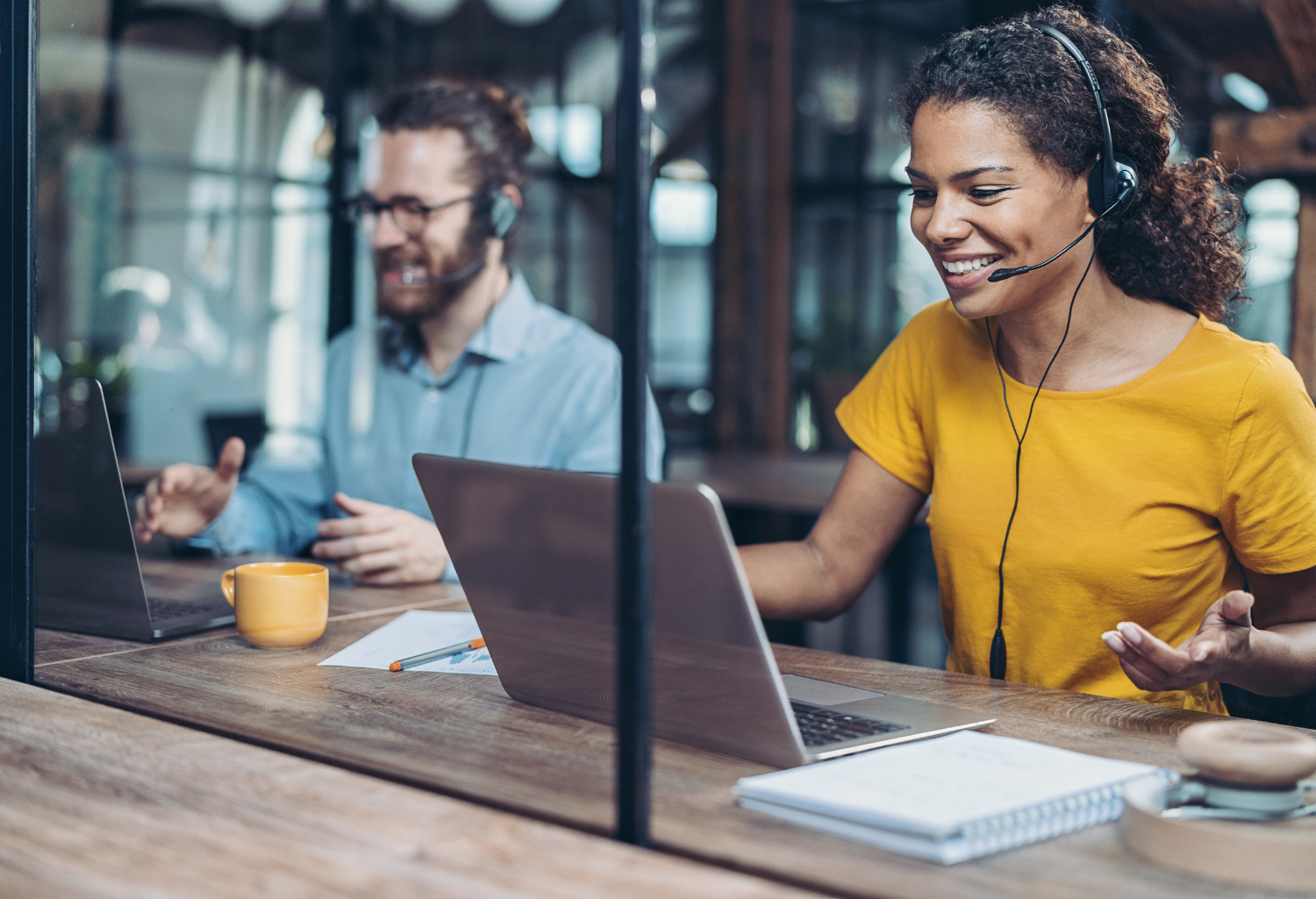 Women and man in the IT industry working on computers.